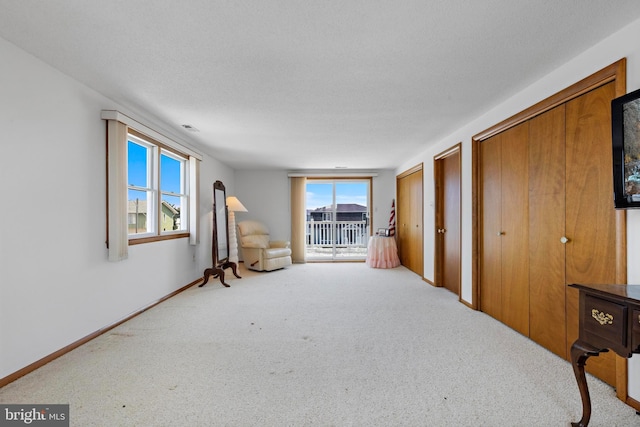 18 Old Whaling Ln, Long Beach Township, NJ 08008 - unfurnished bedroom with carpet, multiple windows, and two closets