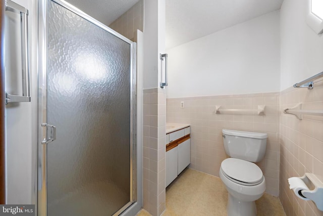 18 Old Whaling Ln, Long Beach Township, NJ 08008 - bathroom with tile walls, a stall shower, vanity, and wainscoting