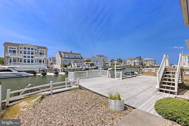 18 Old Whaling Ln, Long Beach Township, NJ 08008 - dock area with a deck with water view, a residential view, and stairway