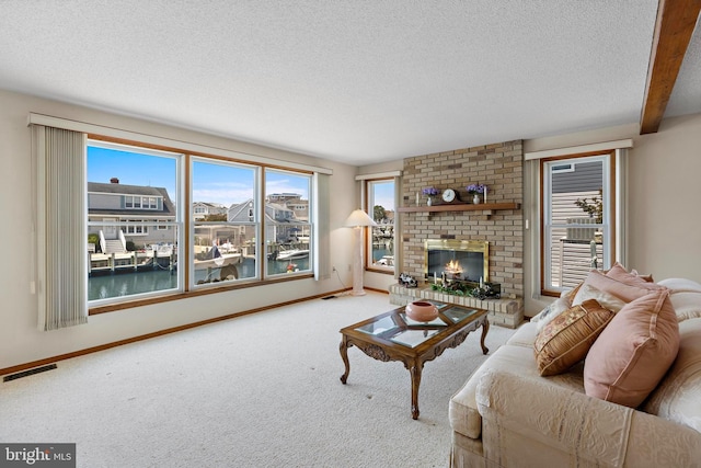 18 Old Whaling Ln, Long Beach Township, NJ 08008 - carpeted living area featuring a textured ceiling and a fireplace