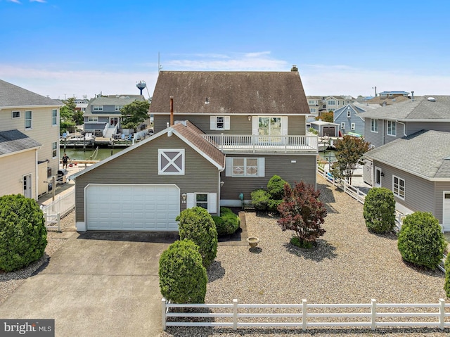 18 Old Whaling Ln, Long Beach Township, NJ 08008 - view of front of house with a residential view, a garage, and concrete driveway