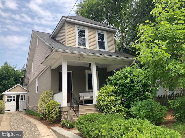 303 Conway Ave, Narberth, PA 19072 - bungalow-style home featuring a porch, an outdoor structure, a shingled roof, and stucco siding
