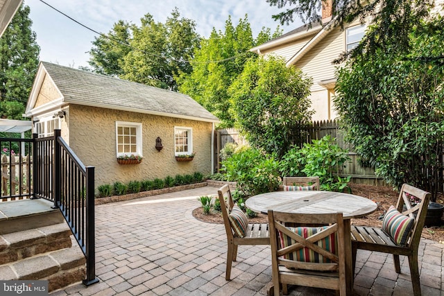 303 Conway Ave, Narberth, PA 19072 - fenced backyard with a patio area and outdoor dining space