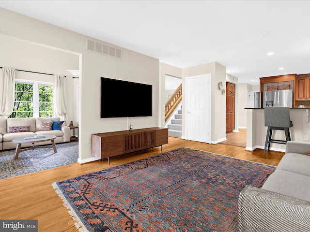 2772 Gingerview Ln, Annapolis, MD 21401 - living area featuring light wood-style floors, recessed lighting, stairs, and baseboards