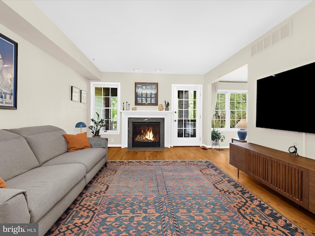 2772 Gingerview Ln, Annapolis, MD 21401 - living area featuring wood finished floors, a premium fireplace, and baseboards