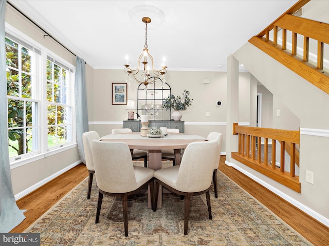 2772 Gingerview Ln, Annapolis, MD 21401 - dining space featuring a chandelier, wood finished floors, baseboards, crown molding, and stairway