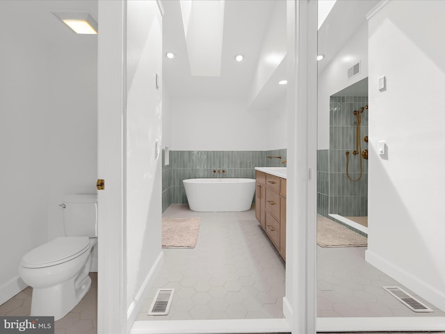 2772 Gingerview Ln, Annapolis, MD 21401 - full bathroom with vanity, tile patterned floors, a freestanding tub, tiled shower, and recessed lighting