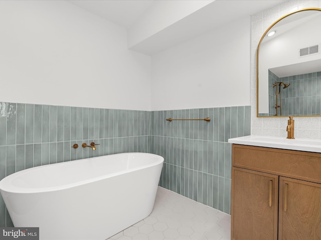 2772 Gingerview Ln, Annapolis, MD 21401 - full bathroom featuring tile walls, a freestanding bath, vanity, wainscoting, and tile patterned flooring
