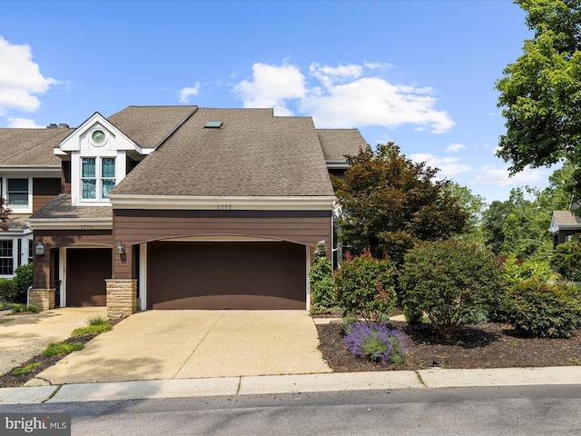 2772 Gingerview Ln, Annapolis, MD 21401 - view of front of property with driveway, an attached garage, a shingled roof, and stone siding