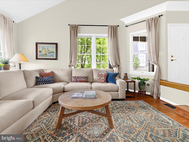 2772 Gingerview Ln, Annapolis, MD 21401 - living area featuring lofted ceiling, wood finished floors, and baseboards