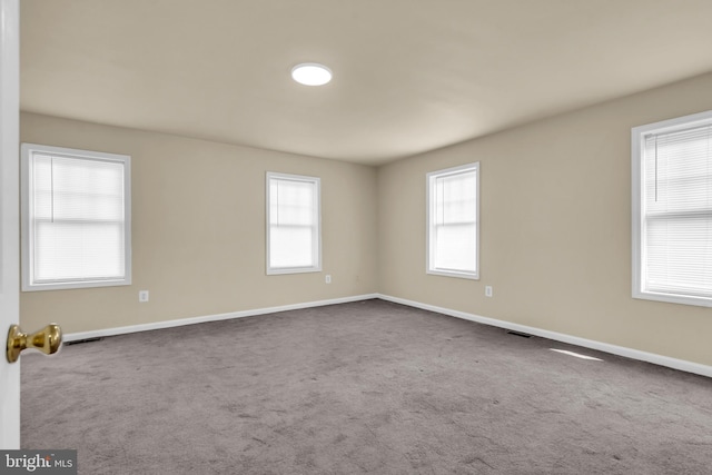 2923 Wasp Rd, Camden, NJ 08104 - unfurnished room with plenty of natural light, dark carpet, and baseboards