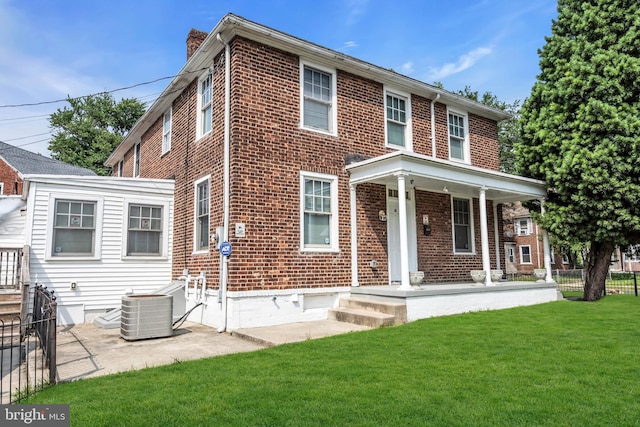2923 Wasp Rd, Camden, NJ 08104 - view of front of property featuring brick siding, cooling unit, a chimney, and a porch
