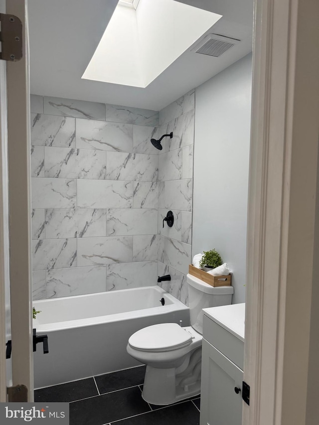 448 Carvel Beach Rd, Carvel Beach, MD 21226 - bathroom featuring toilet, vanity, bathtub / shower combination, and a skylight
