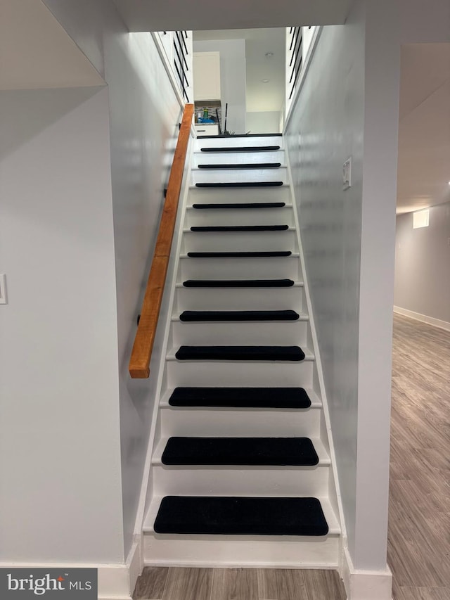 448 Carvel Beach Rd, Carvel Beach, MD 21226 - stairs featuring wood finished floors and baseboards