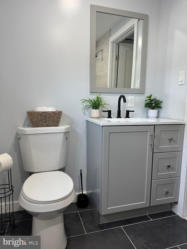 448 Carvel Beach Rd, Carvel Beach, MD 21226 - bathroom featuring tile patterned flooring, vanity, toilet, and baseboards