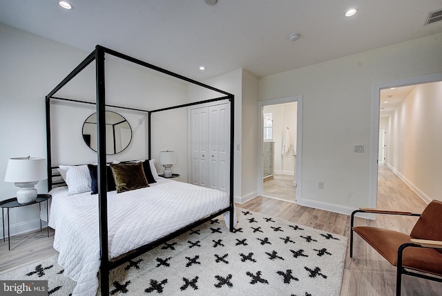 4938 Walton Ave, Philadelphia, PA 19143 - bedroom with light wood-type flooring, recessed lighting, a closet, and ensuite bath