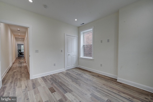 4938 Walton Ave, Philadelphia, PA 19143 - unfurnished bedroom featuring light wood-type flooring, a closet, and recessed lighting