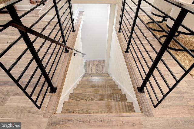 4938 Walton Ave, Philadelphia, PA 19143 - staircase with wood finished floors and baseboards