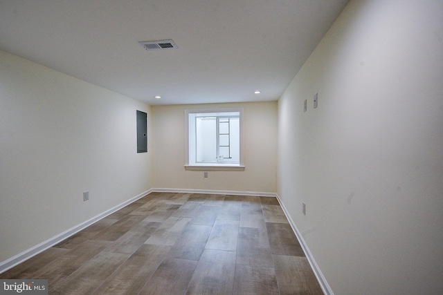 4938 Walton Ave, Philadelphia, PA 19143 - unfurnished room featuring electric panel, recessed lighting, and wood finished floors