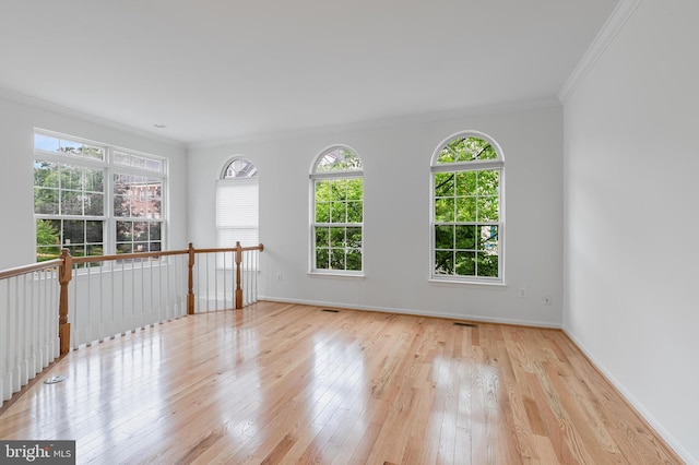 5454 Patuxent Knoll Pl, Alexandria, VA 22312 - unfurnished room featuring ornamental molding, plenty of natural light, wood finished floors, and baseboards