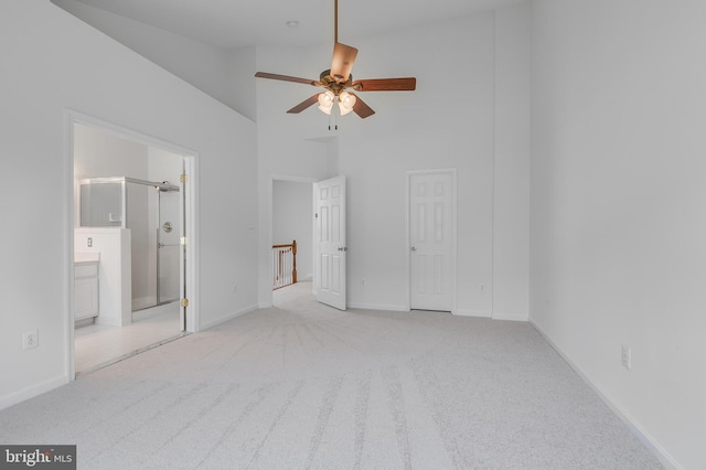 5454 Patuxent Knoll Pl, Alexandria, VA 22312 - unfurnished bedroom with carpet floors, high vaulted ceiling, connected bathroom, and baseboards