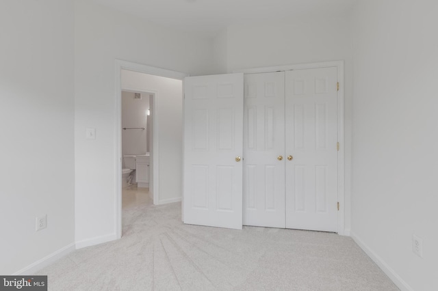 5454 Patuxent Knoll Pl, Alexandria, VA 22312 - unfurnished bedroom featuring carpet flooring, a closet, and baseboards