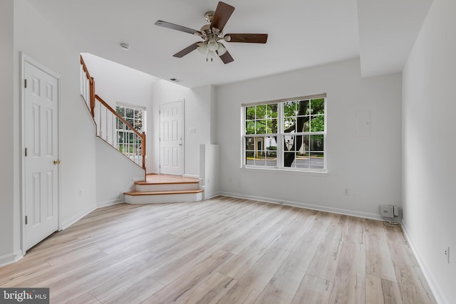 5454 Patuxent Knoll Pl, Alexandria, VA 22312 - unfurnished living room featuring stairway, wood finished floors, ceiling fan, and baseboards
