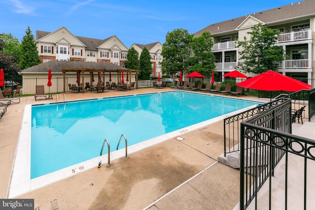 5454 Patuxent Knoll Pl, Alexandria, VA 22312 - community pool featuring a residential view and a patio