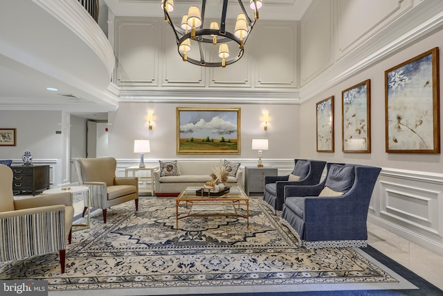 12251 Roundwood Rd Unit 301, Lutherville Timonium, MD 21093 - living room featuring a decorative wall, a chandelier, crown molding, a wainscoted wall, and a high ceiling