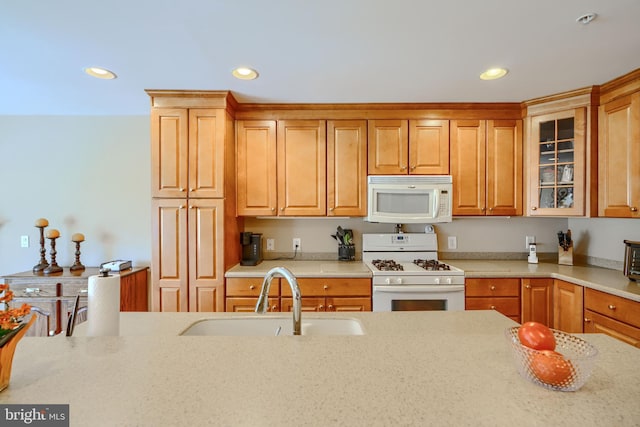 12251 Roundwood Rd Unit 301, Lutherville Timonium, MD 21093 - kitchen with white appliances, glass insert cabinets, recessed lighting, light stone countertops, and brown cabinetry