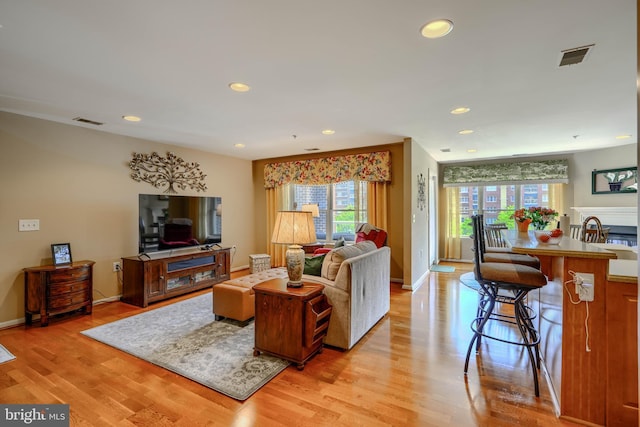 12251 Roundwood Rd Unit 301, Lutherville Timonium, MD 21093 - living area featuring plenty of natural light, light wood-style flooring, and recessed lighting