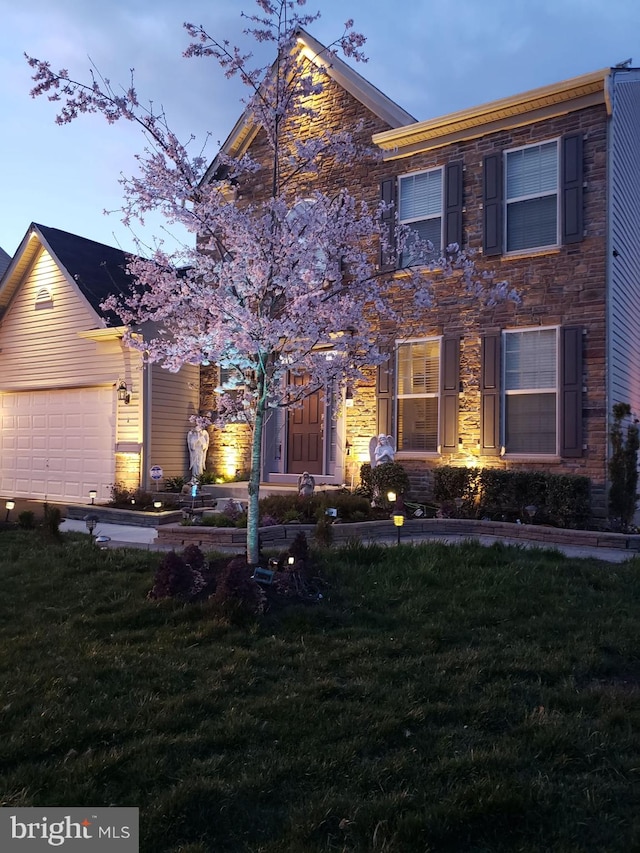 2703 Brownlee Ct, Lanham, MD 20706 - view of front of property with a front yard, a garage, and stone siding
