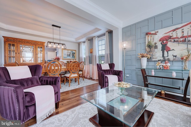 2703 Brownlee Ct, Lanham, MD 20706 - living room featuring wood finished floors, ornamental molding, a raised ceiling, and a chandelier