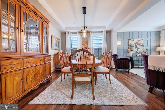 2703 Brownlee Ct, Lanham, MD 20706 - dining space with a raised ceiling, dark wood-type flooring, and crown molding