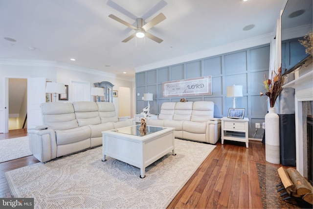 2703 Brownlee Ct, Lanham, MD 20706 - living area featuring crown molding, wood-type flooring, ceiling fan, recessed lighting, and a fireplace