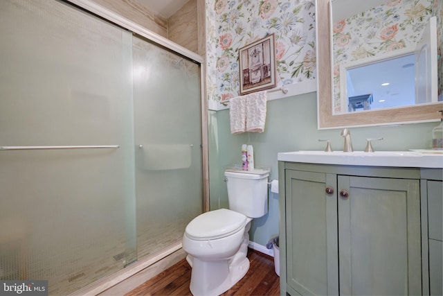 2703 Brownlee Ct, Lanham, MD 20706 - bathroom with vanity, wood finished floors, toilet, a shower stall, and baseboards