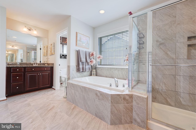 2703 Brownlee Ct, Lanham, MD 20706 - bathroom with a bath, vanity, a stall shower, and toilet