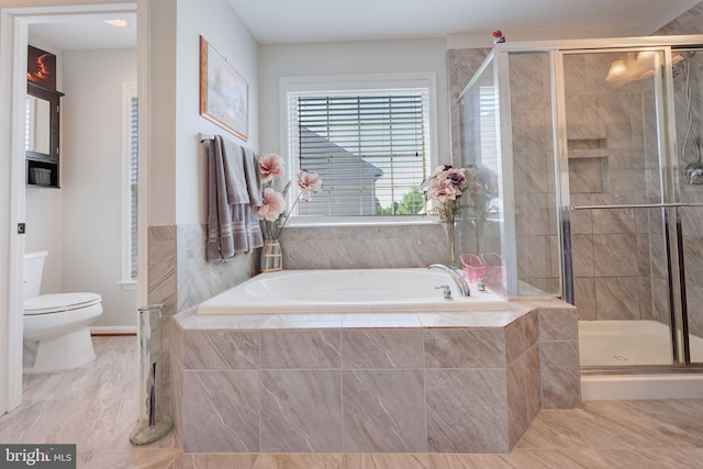 2703 Brownlee Ct, Lanham, MD 20706 - full bath featuring toilet, a garden tub, a stall shower, and marble finish flooring