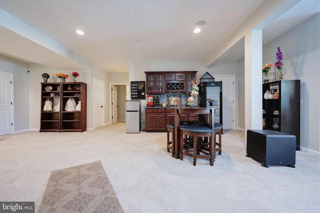 2703 Brownlee Ct, Lanham, MD 20706 - kitchen with freestanding refrigerator, dark countertops, light carpet, glass insert cabinets, and recessed lighting