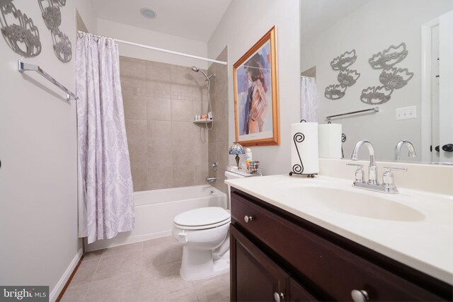 2703 Brownlee Ct, Lanham, MD 20706 - bathroom featuring vanity, toilet, shower / bath combo with shower curtain, tile patterned floors, and baseboards