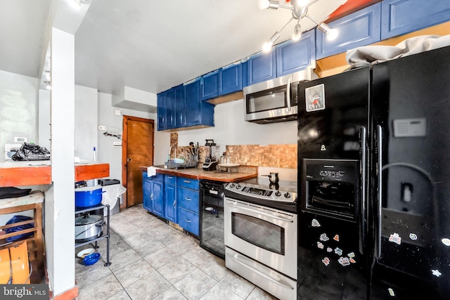 6720 Dorel St, Philadelphia, PA 19142 - kitchen featuring appliances with stainless steel finishes, blue cabinets, and light tile patterned flooring