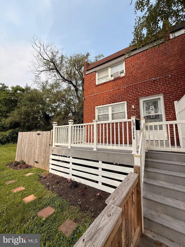3826 W Bay Ave, Baltimore, MD 21225 - view of home's exterior with brick siding and a wooden deck