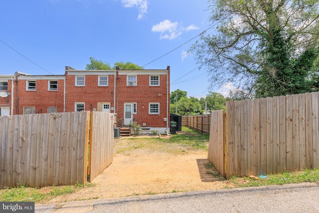 3826 W Bay Ave, Baltimore, MD 21225 - view of home's exterior featuring a fenced backyard and brick siding