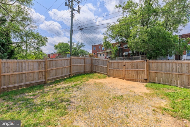 3826 W Bay Ave, Baltimore, MD 21225 - fenced backyard featuring a gate