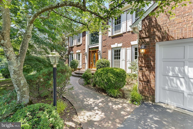 4920 Sunset Ln, Annandale, VA 22003 - view of front of property featuring brick siding and a garage