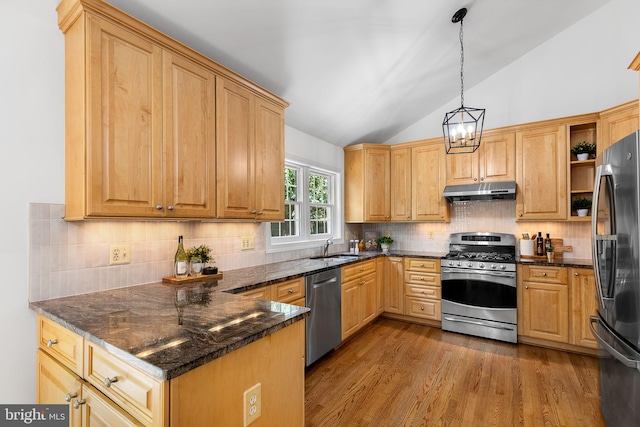 4920 Sunset Ln, Annandale, VA 22003 - kitchen with stainless steel appliances, lofted ceiling, under cabinet range hood, wood finished floors, and a chandelier