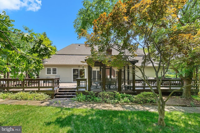 4920 Sunset Ln, Annandale, VA 22003 - back of house with a deck, roof with shingles, and a lawn