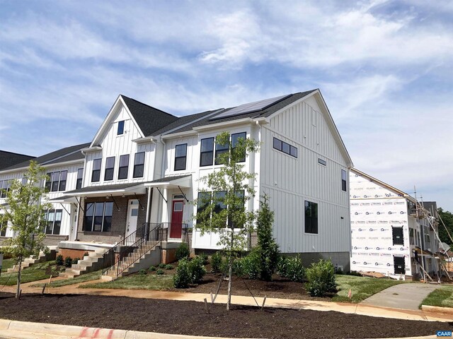 3018 Horizon Rd, Charlottesville, VA 22902 - view of front facade featuring board and batten siding and roof mounted solar panels