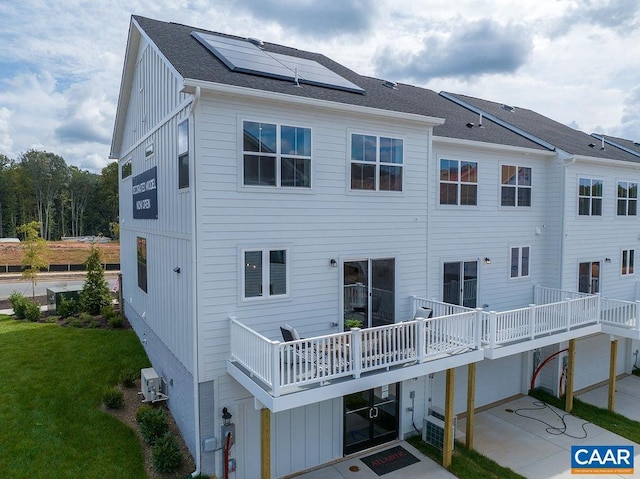 3018 Horizon Rd, Charlottesville, VA 22902 - back of property featuring roof mounted solar panels, board and batten siding, a yard, and driveway