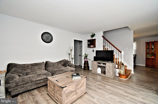 121 Shaffer Rd, King Of Prussia, PA 19406 - living room featuring stairs and light wood-style floors